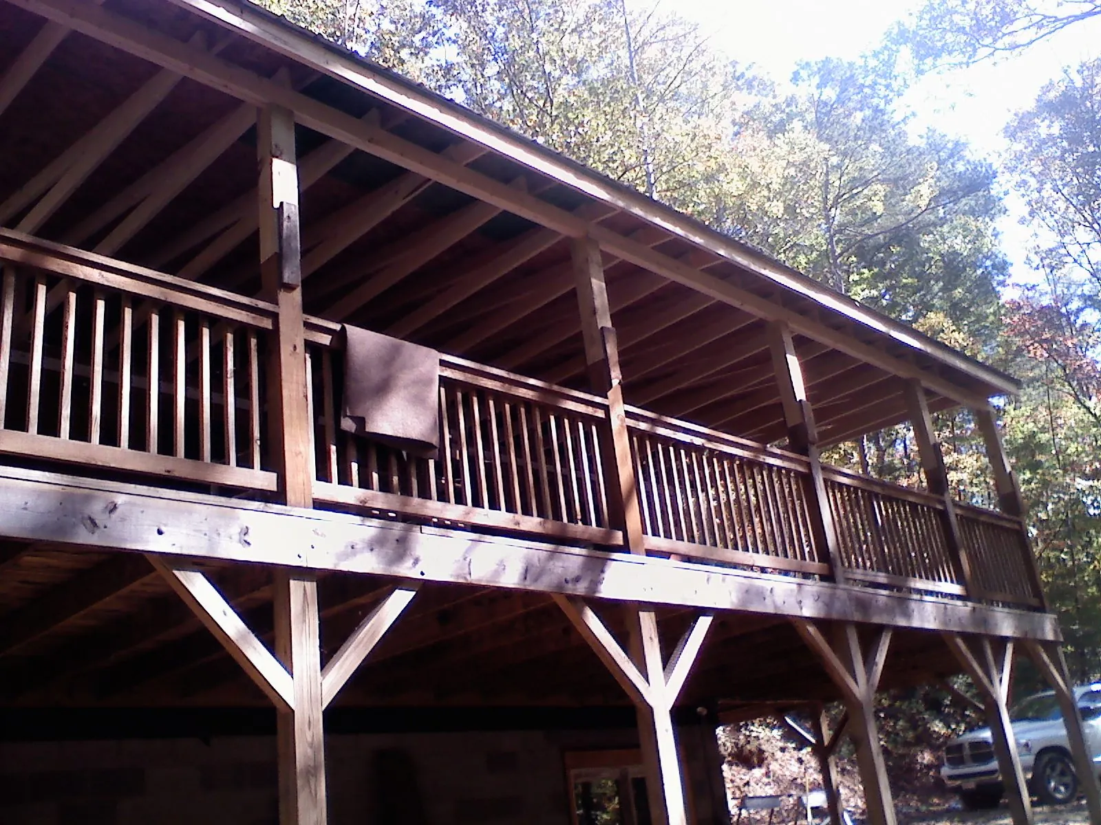 Timber framing under a new elevated porch and deck — Roof Leak Repair in Clio by Roofing Brothers